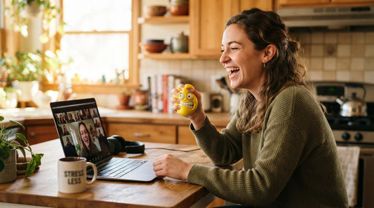 Laughing while opening a playful gift on a video call