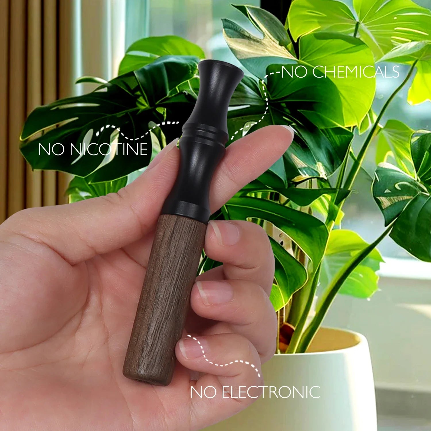 Wooden inhaler stick with black mouthpiece and walnut-toned lower body held beside a green houseplant, smokeless and nicotine-free