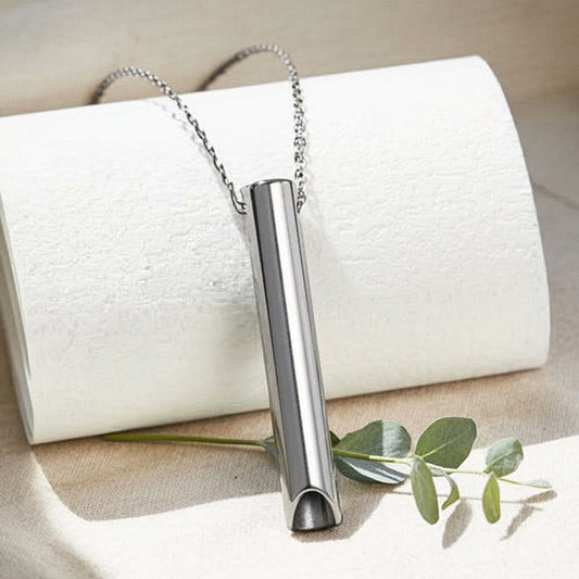 Silver mindful breathing necklace pendant on linen